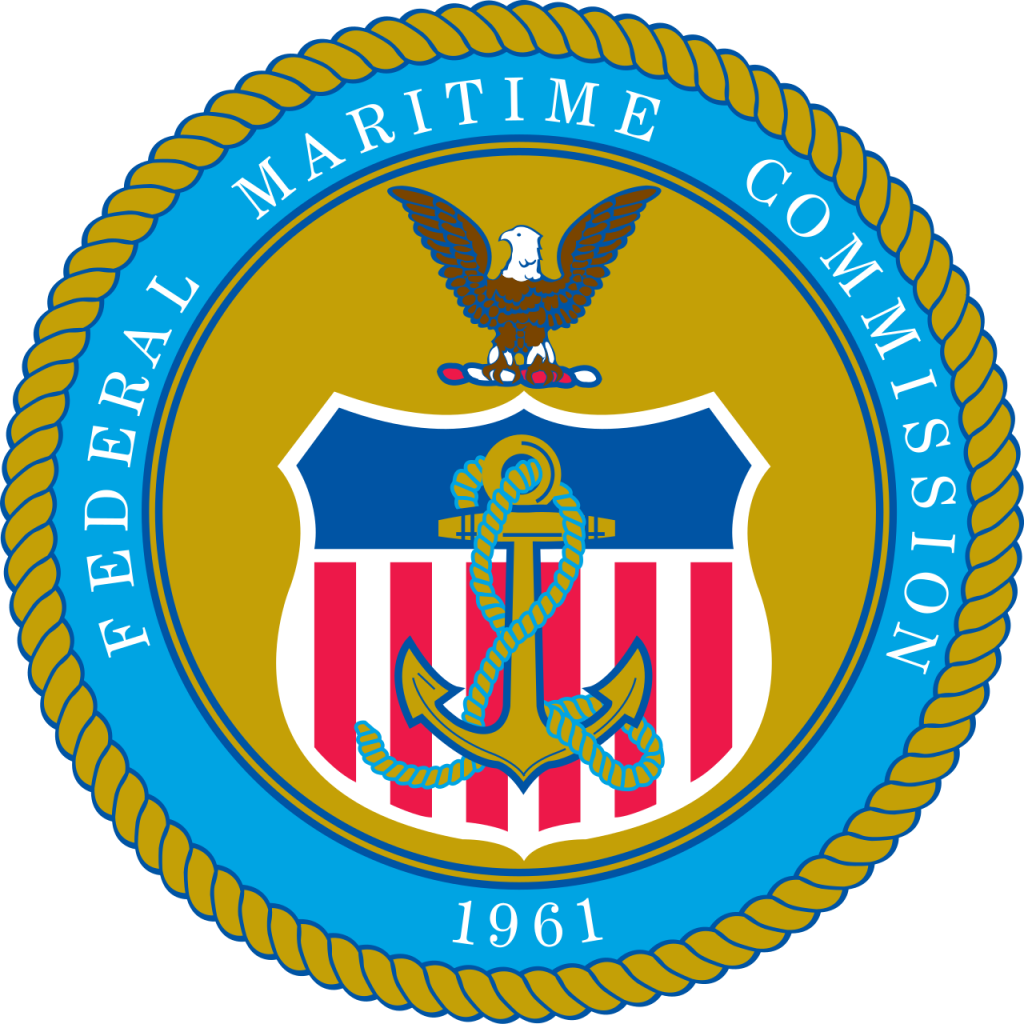 A circular federal seal featuring an anchor-wrapped shield beneath a perched eagle, surrounded by a rope border and blue ring reading "Federal Maritime Commission" with the year "1961."